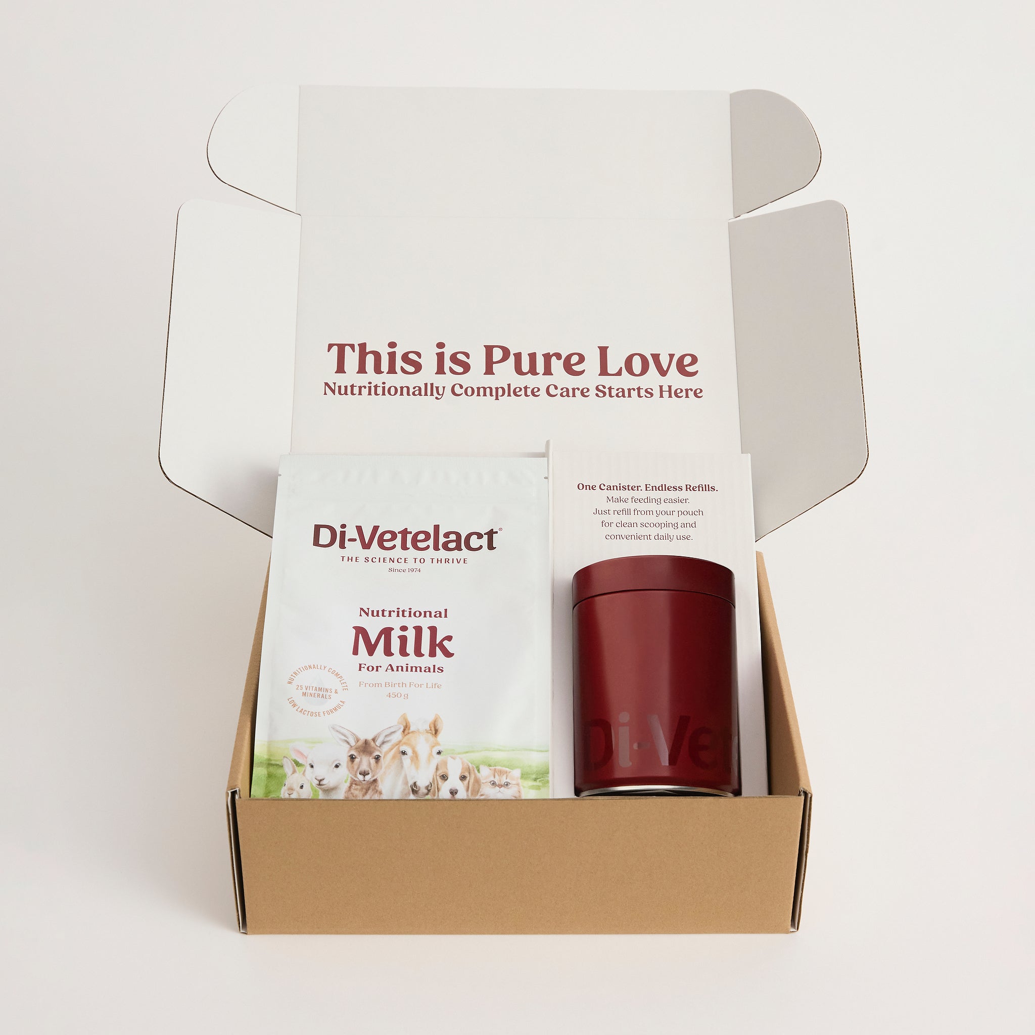 Di-Vetelact Welcome Kit Box open and revealing contents containing Di-Vetelact Nutritional Milk for animals 450g Pouch with a branded canister on a white background.