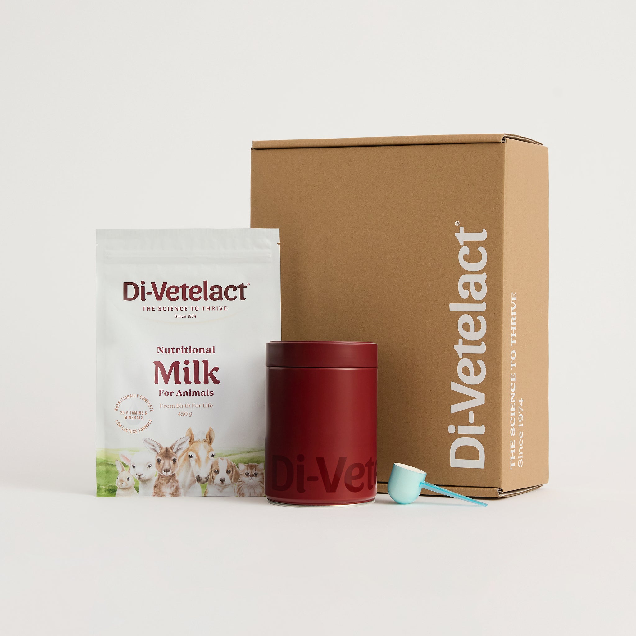 Di-Vetelact Welcome Kit with 450g nutritional milk pouch a branded canister , scoop and mailer box on a white background