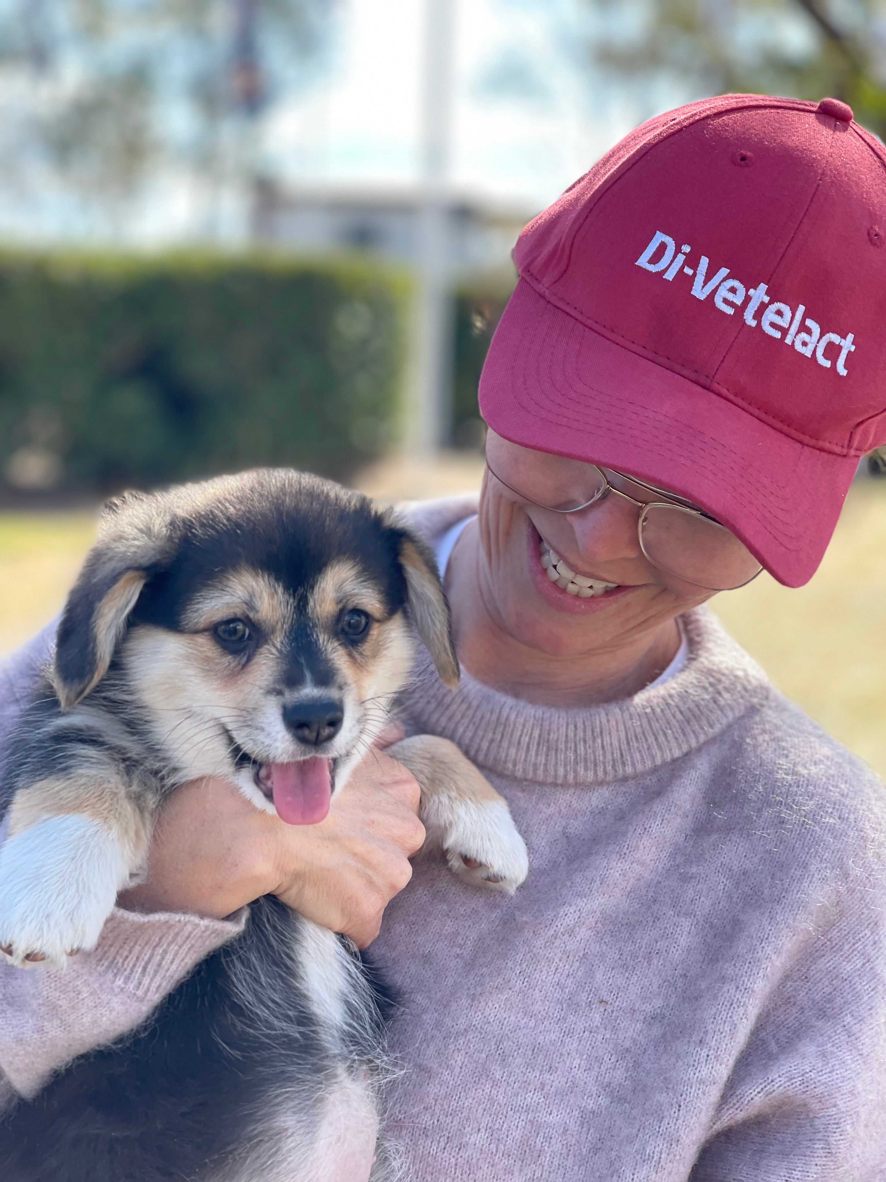 Woman holding happy puppy
